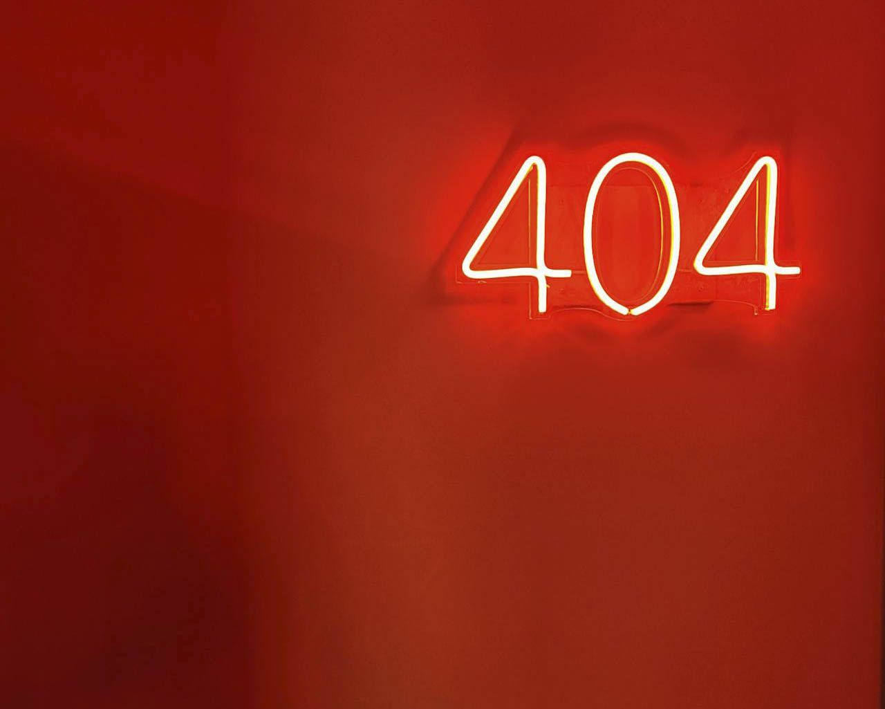 A neon sign displaying the common 404 error